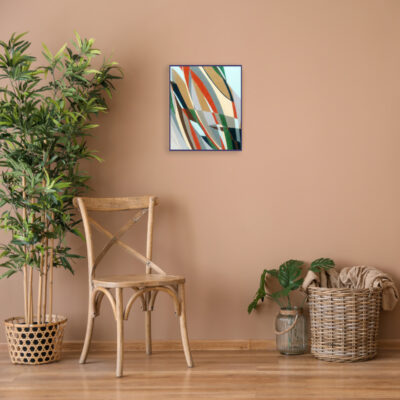 Wooden chair with wicker basket and plant near color wall