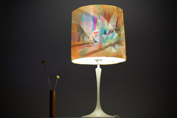 a vintage midcentury lamp from the 60s with a large brown lampsh