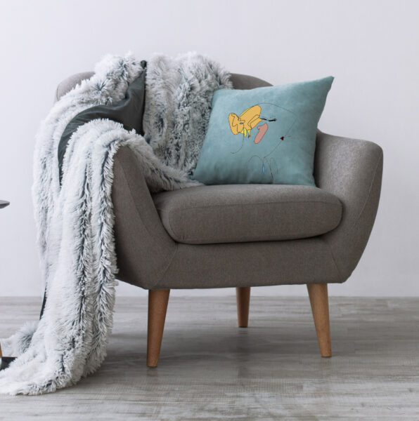 Minimalist home workspace design. Modern armchair with blue pillow and soft plaid, next to small table with laptop in scandinavian interior with light wall, empty space for ad, flat lay, panorama