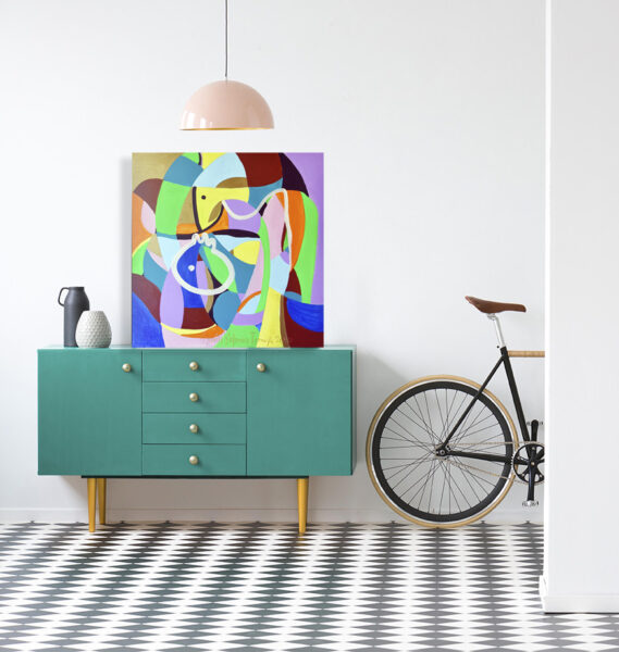 Plant and poster on green cabinet in retro living room interior with bicycle and copy space on the wall